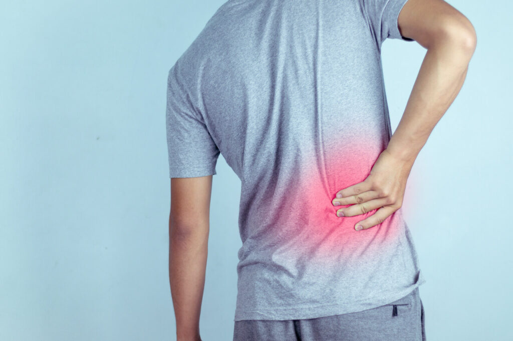 man suffering from backache,Lower back pain